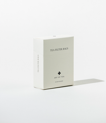 A white box labeled 'TEA FILTER BAGS' from Art of Tea, containing 100 biodegradable filter bags for loose leaf tea.